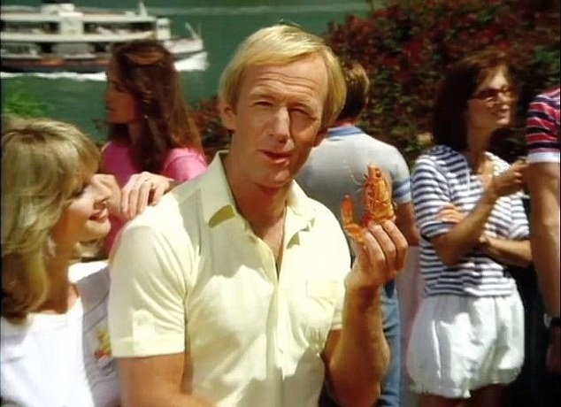 Paul Hogan holding up a prawn