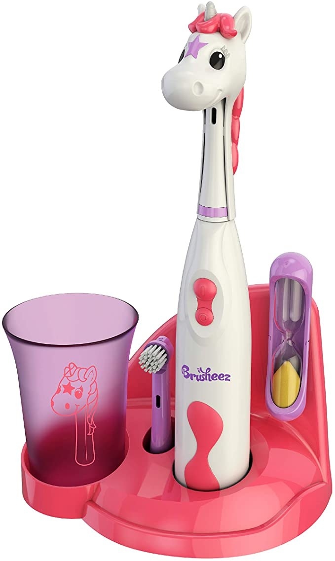 The unicorn electric toothbrush with a rinse cup and sand timer