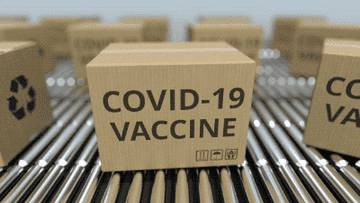 Animated boxes labeled &quot;COVID-19 vaccine&quot; rushing along shipping conveyor belts