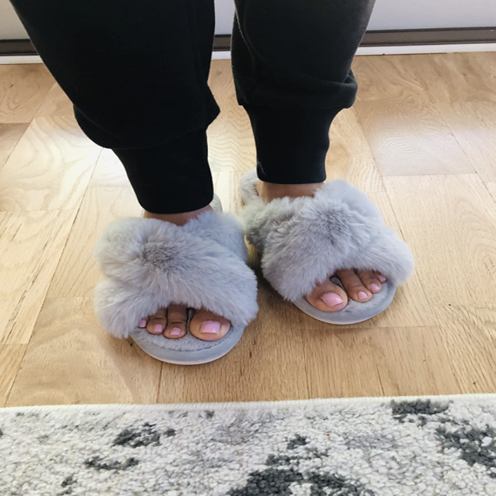 reviewer wearing slippers in grey