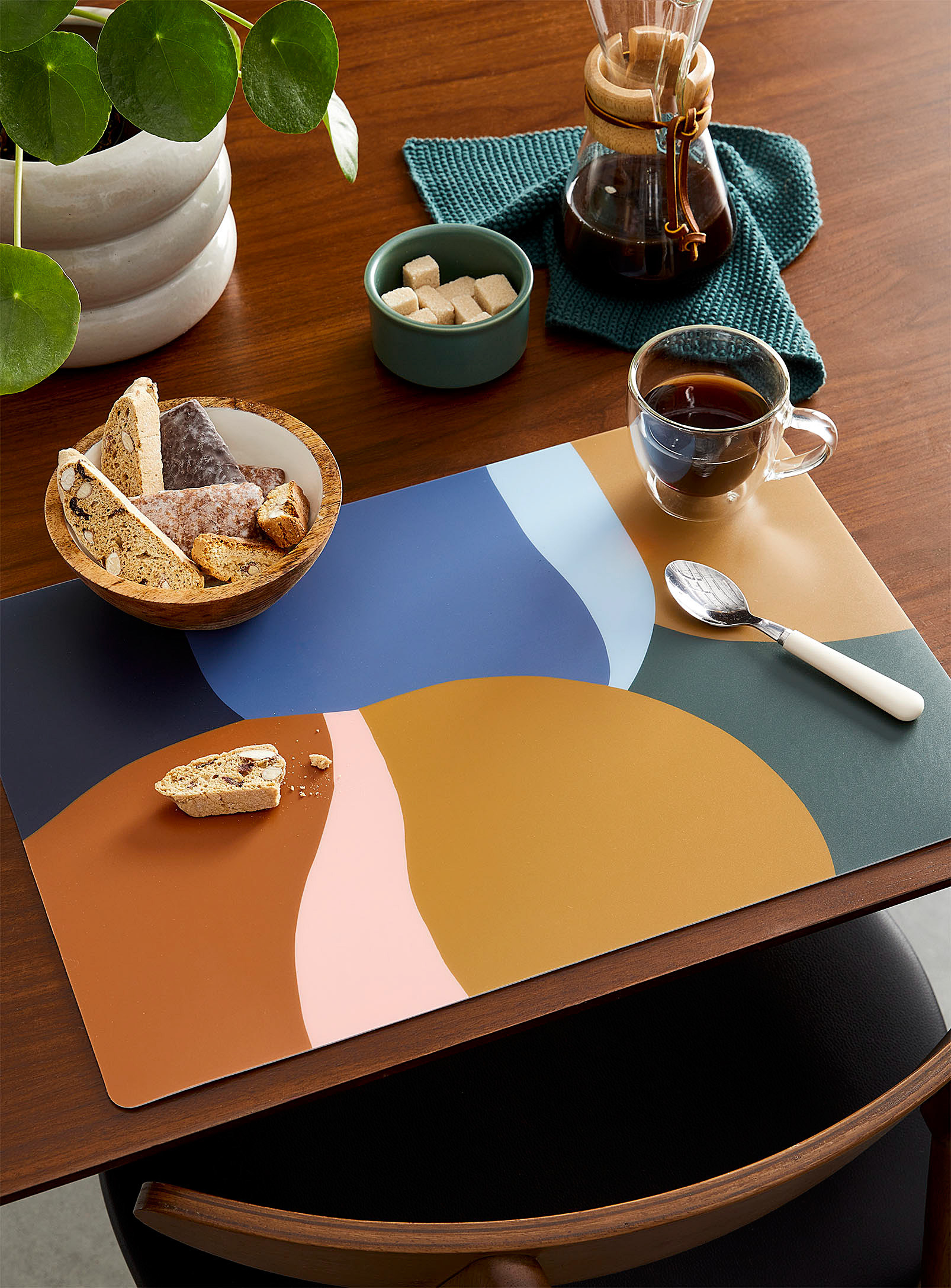 a colourful placemat on a table