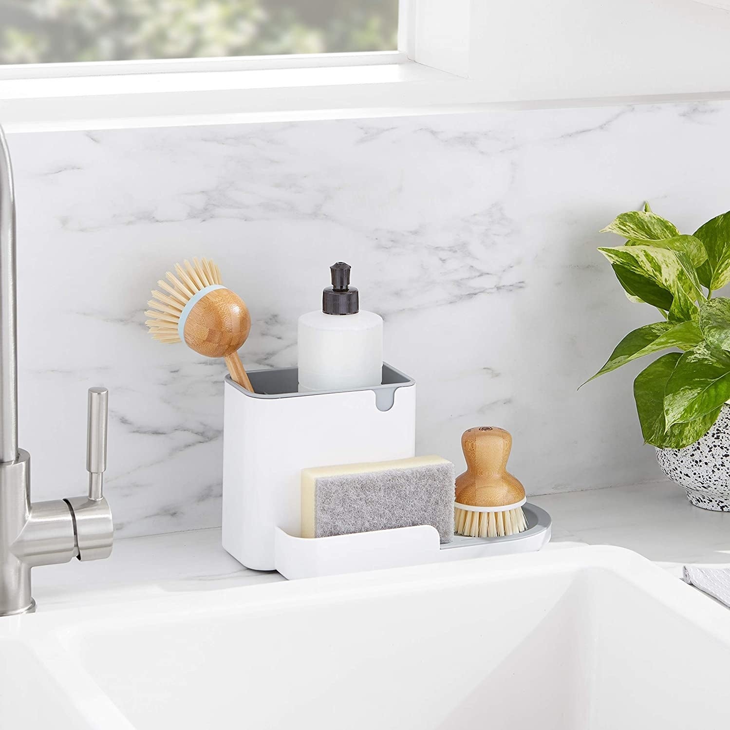 Several brushes and bottles in the organizer