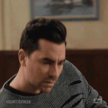 Dan Levy from a scene in Schitts Creek looking impressed and saying cute