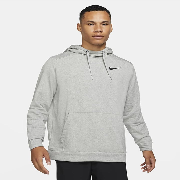 model wearing a grey hoodie sweatshirt