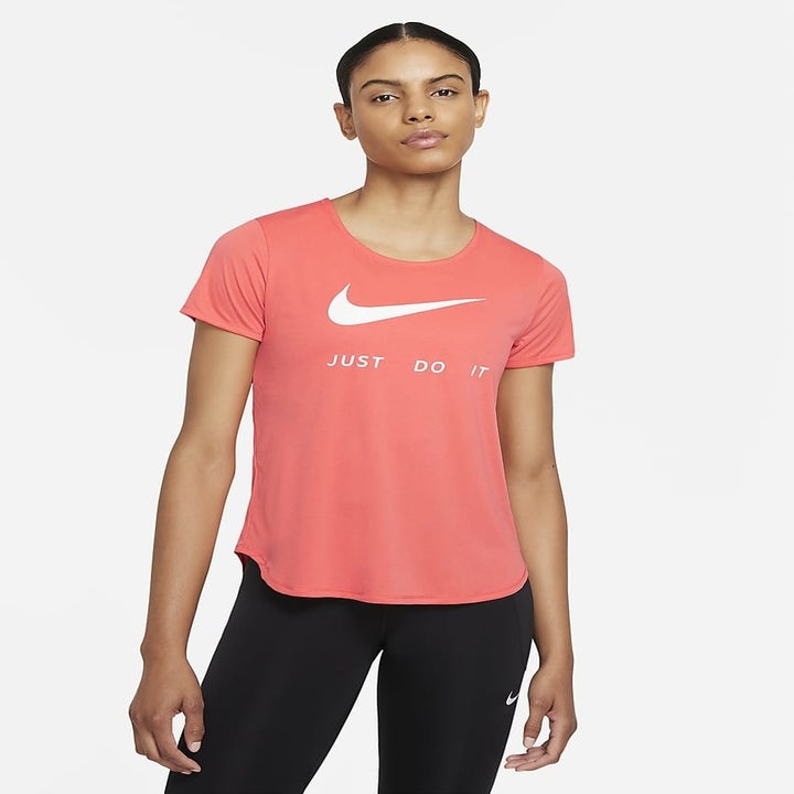 model wearing a salmon pink running t shirt