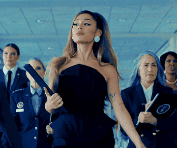 Arianna Grande walking with confidence.