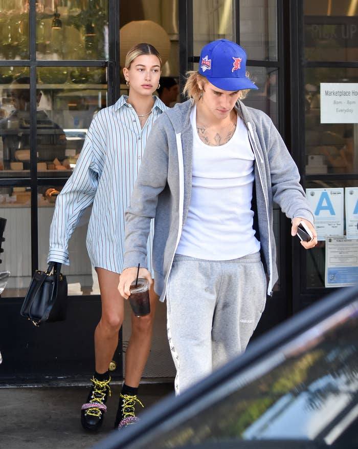 Hailey and Justin walking out of cafe
