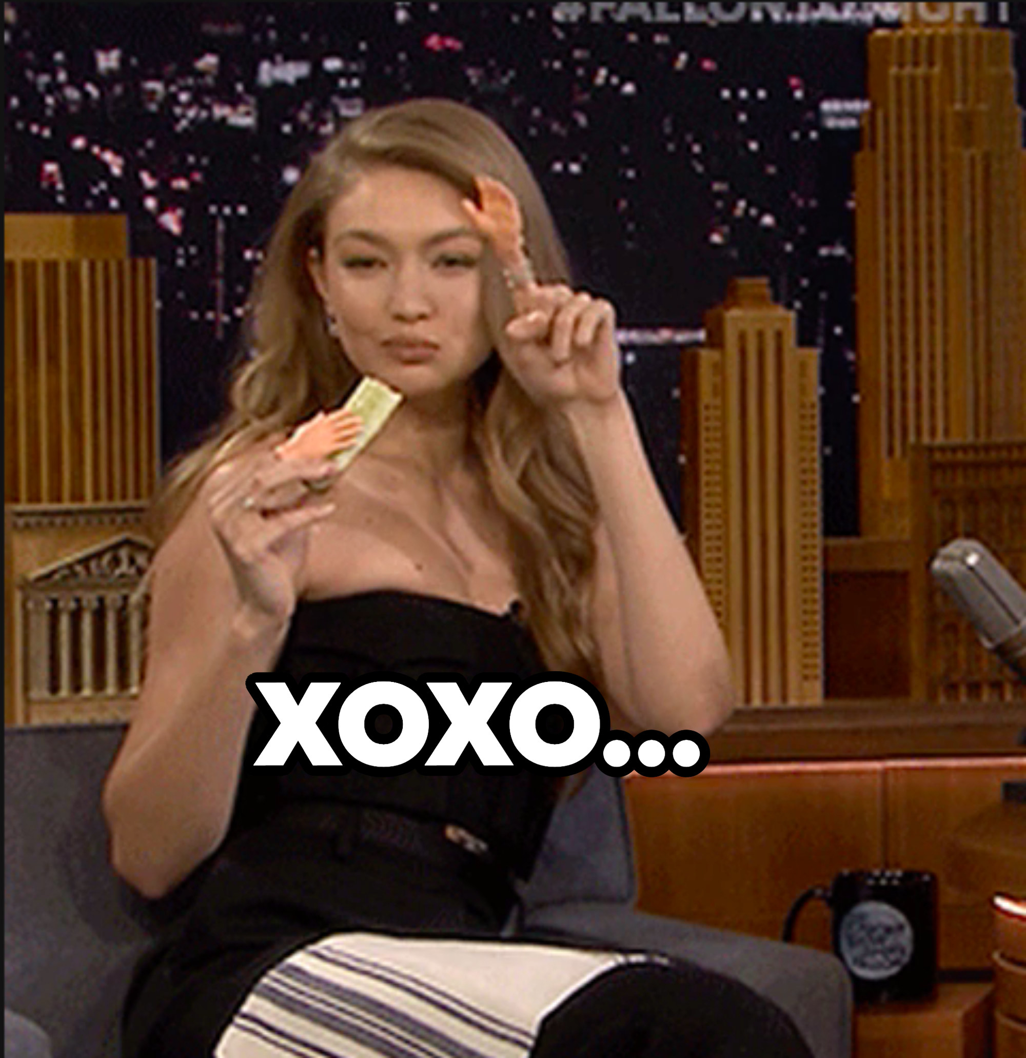 Gigi Hadid waving with tiny hands