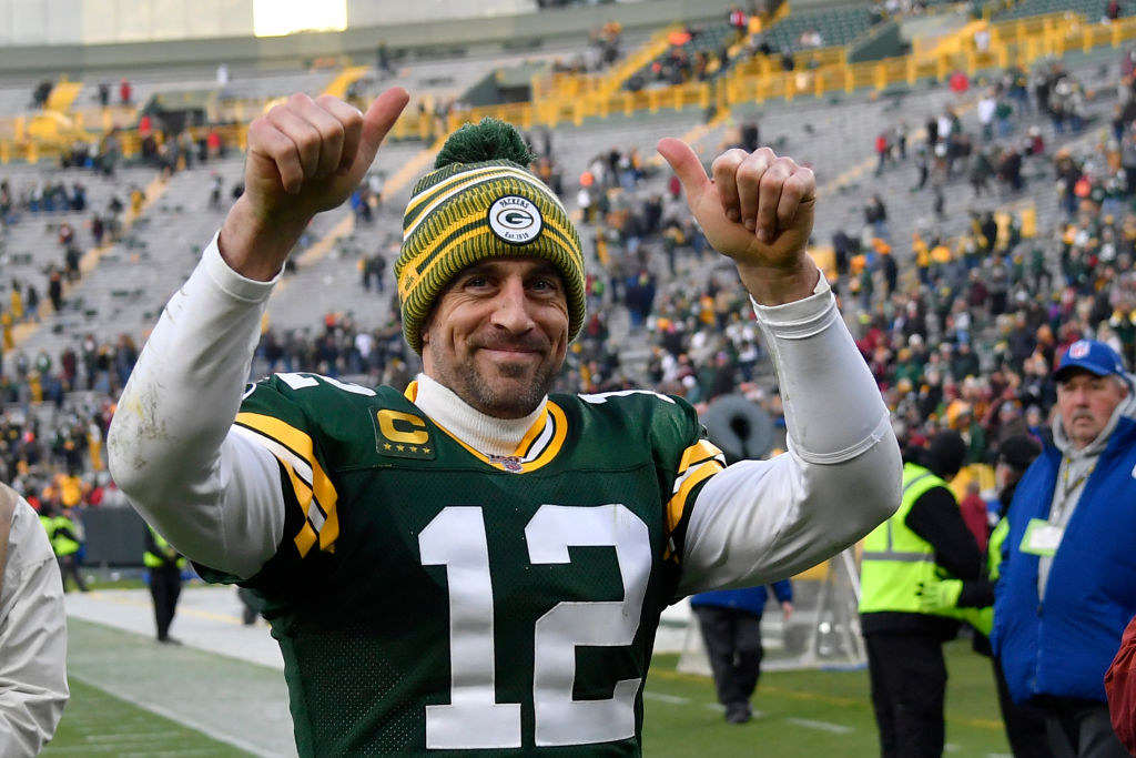 Aaron giving two thumbs up as he walks off the football field