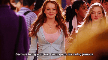 Lindsey Lohan in Mean Girls marching through the hall with confidence