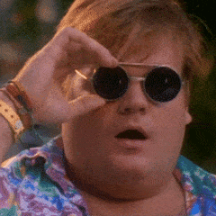 Chris Farley taking off his sunglasses with shock