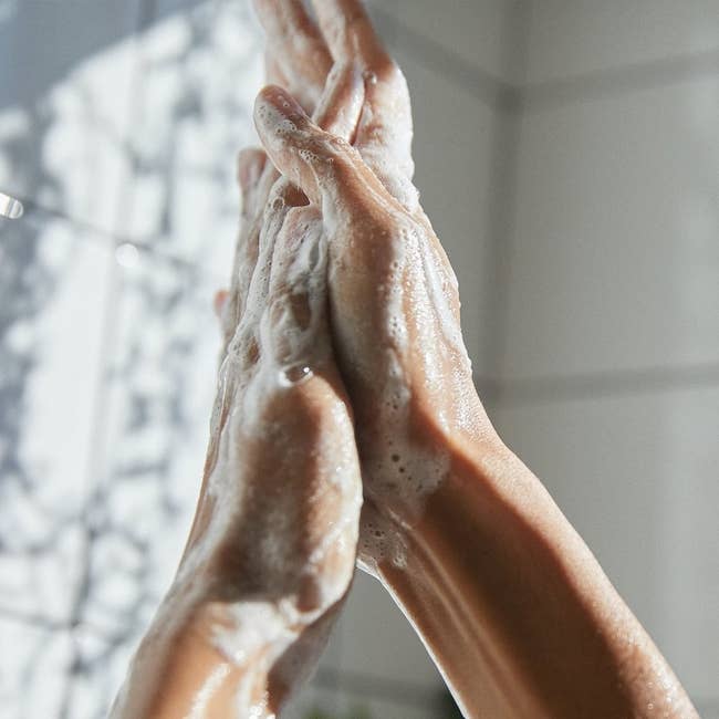 foam of shampoo on hands