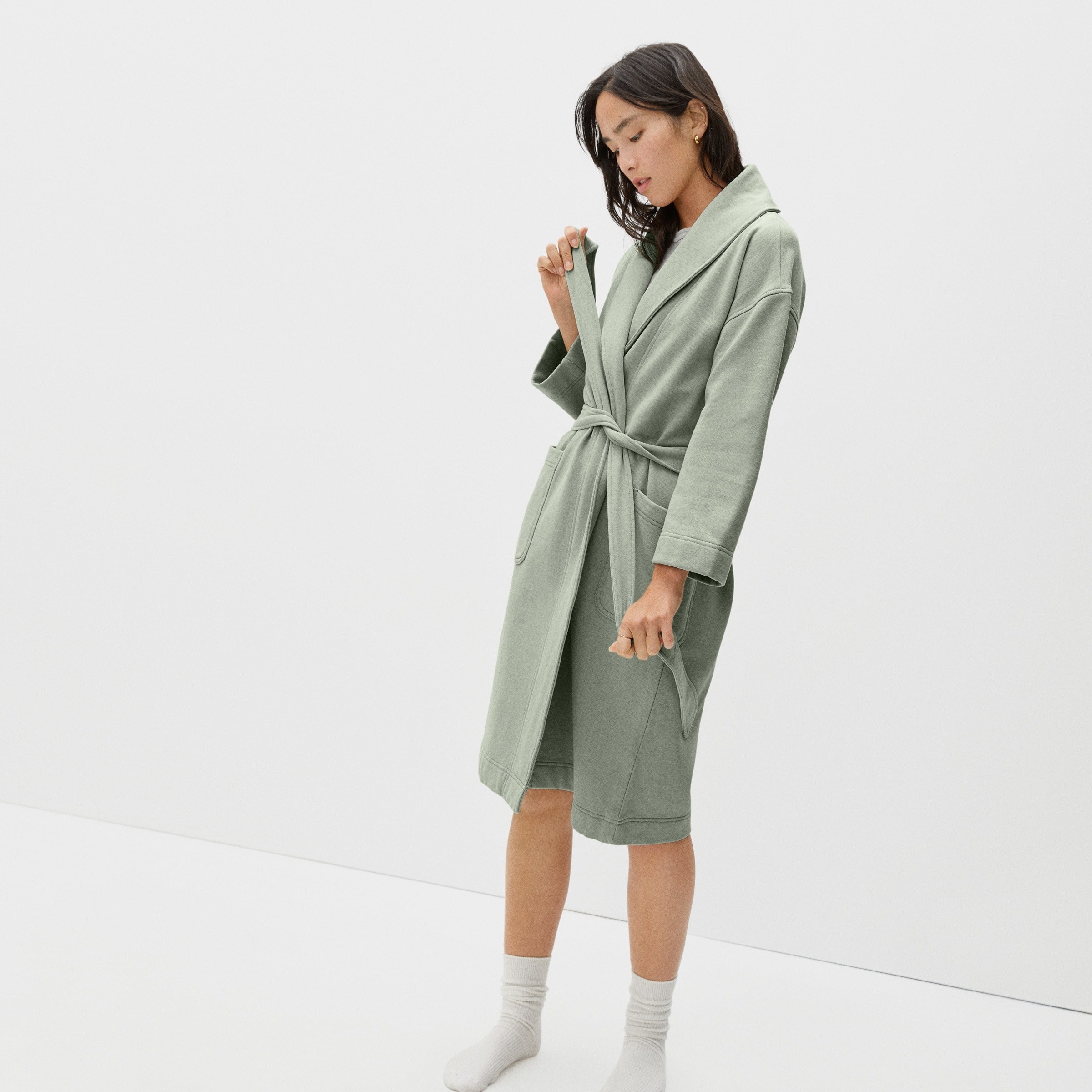 a model in a green terry robe