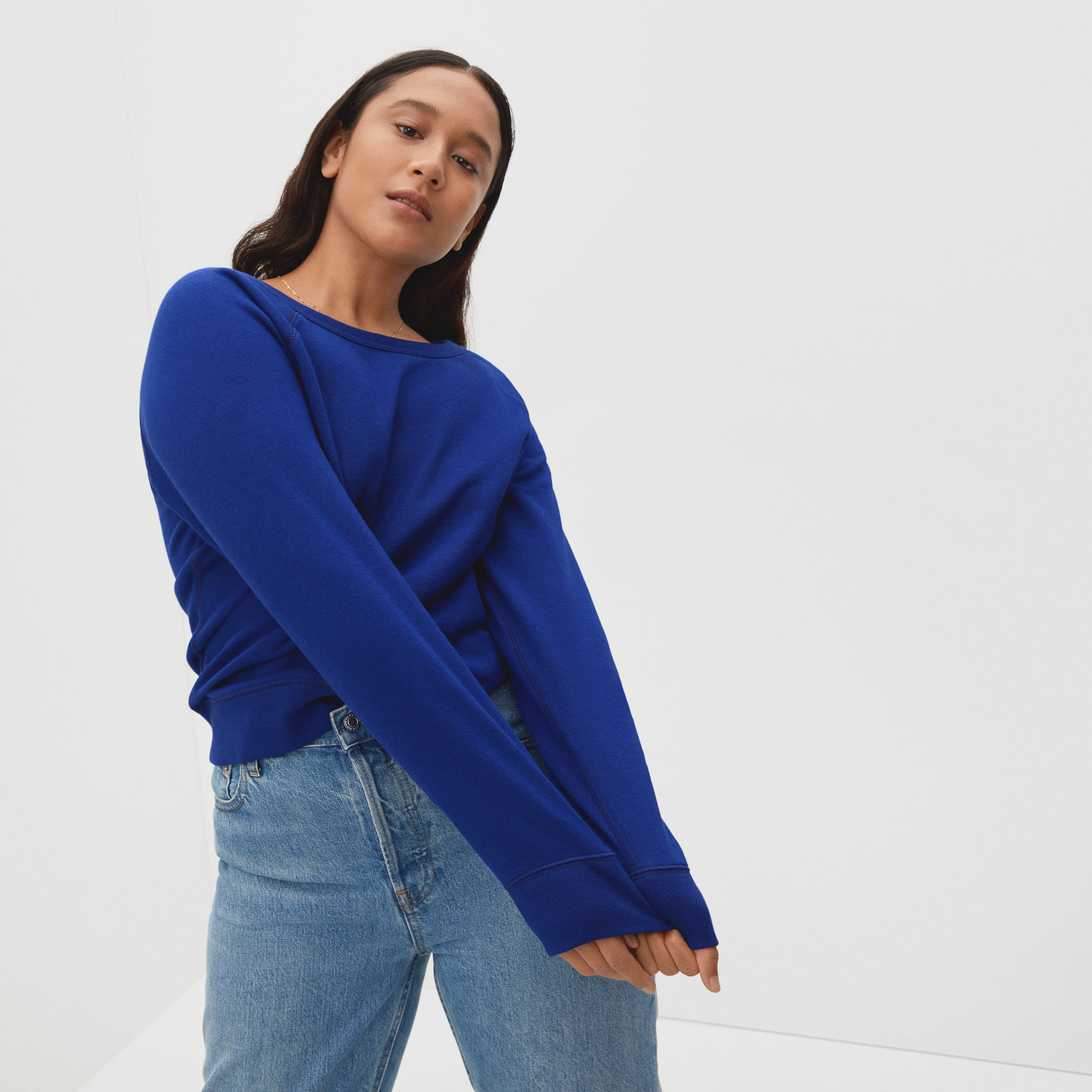 a model in a royal blue pullover