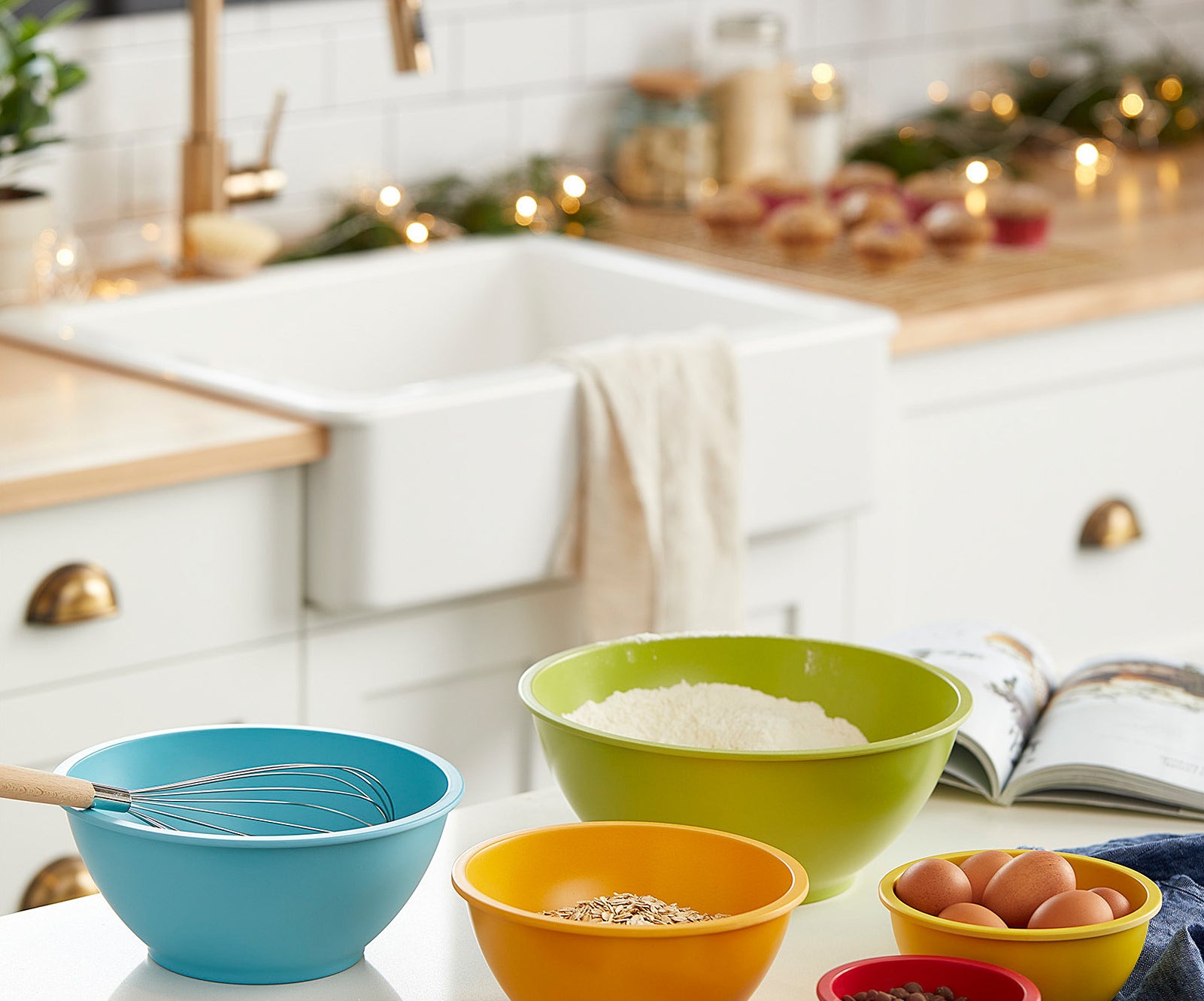 five colourful bowls with various ingredients in them on a kitchen counter