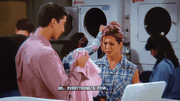 A GIF of Ross showing Rachel pink laundry