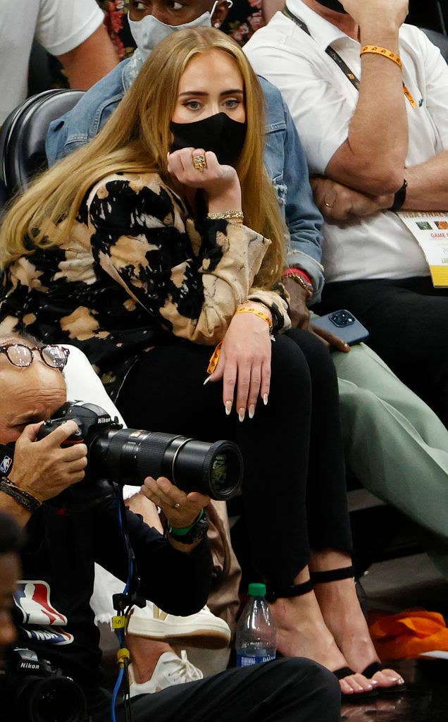 Adele's hair runs half way down her back