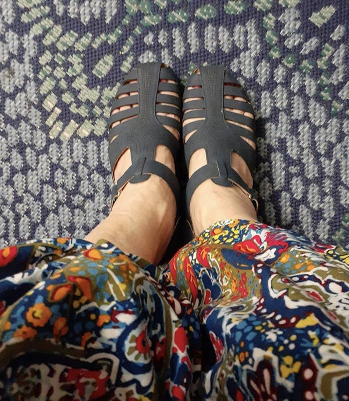 a reviewer wearing the sandals in navy