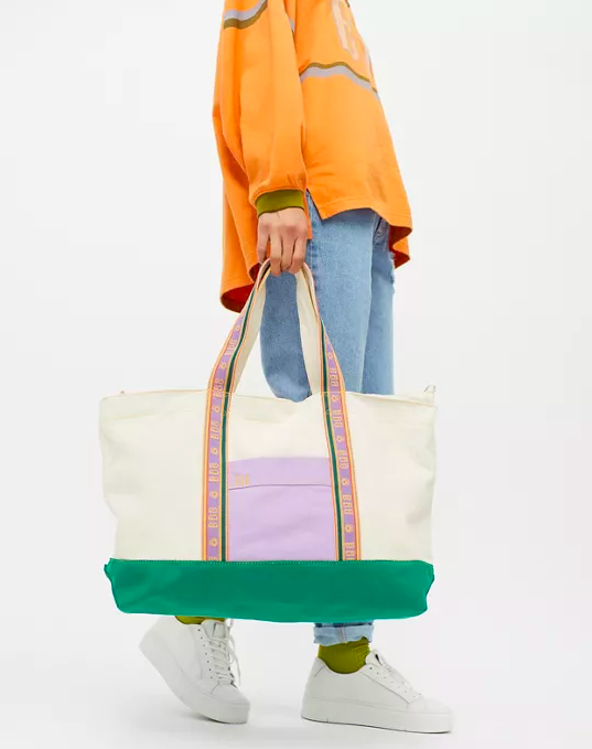 a person carrying the vibrant tote bag