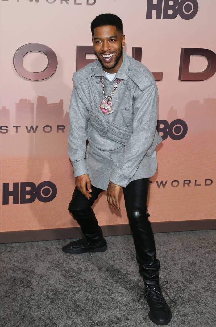 Kid Cudi smiling at a red carpet event