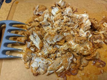 A reviewer photo of cooked chicken shredded by the Bear Claws