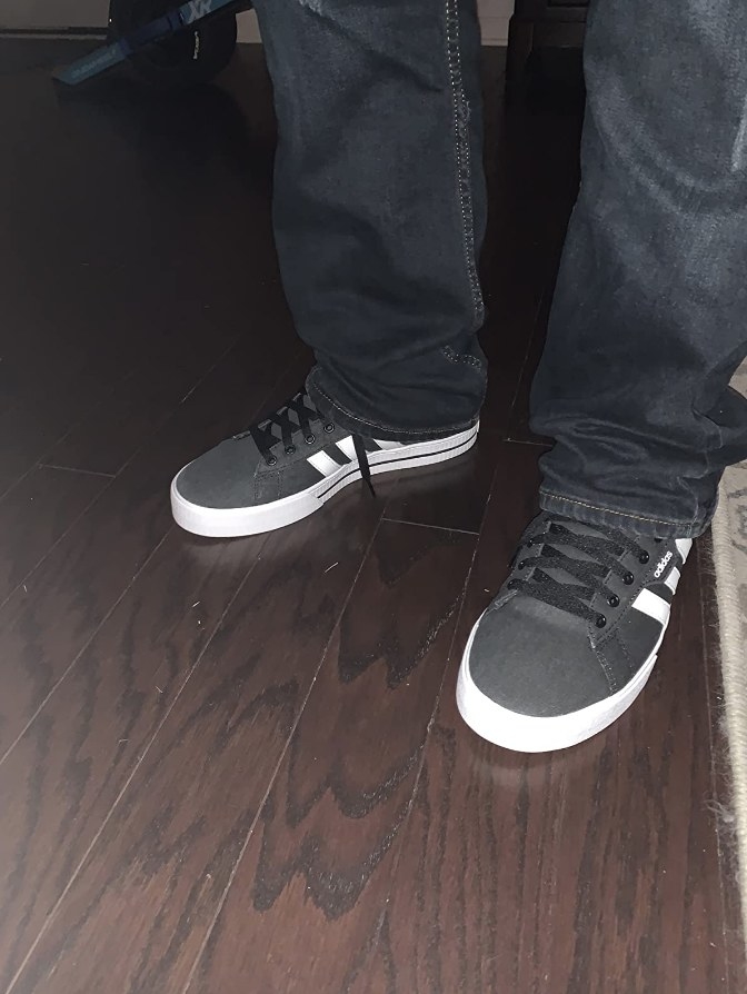 Reviewer wearing dark gray adidas skate sneaker