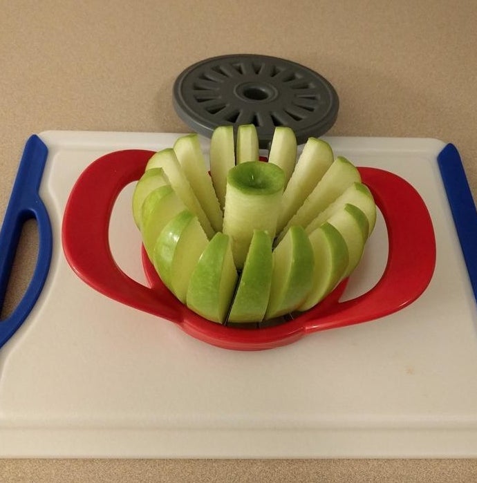 Reviewer photo of a Granny Smith apple sliced by the apple divider