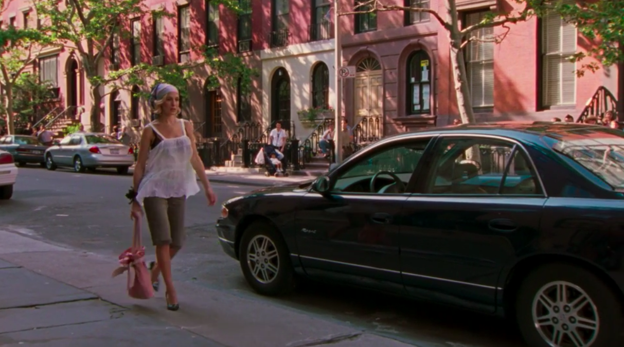 Carrie Bradshaw walking down the street