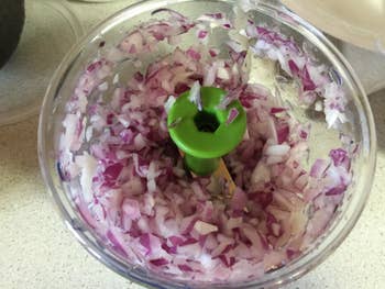 Reviewer photos of chopped onions inside a chopper