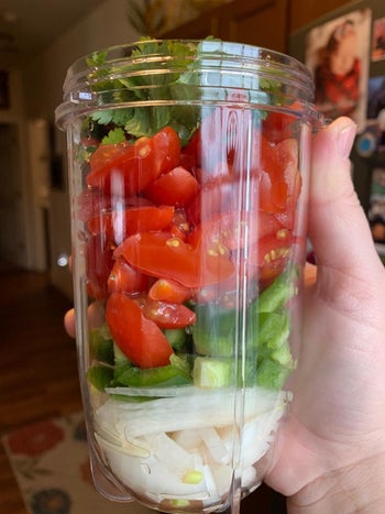 Reviewer photo of a magic bullet cup filled with vegetables