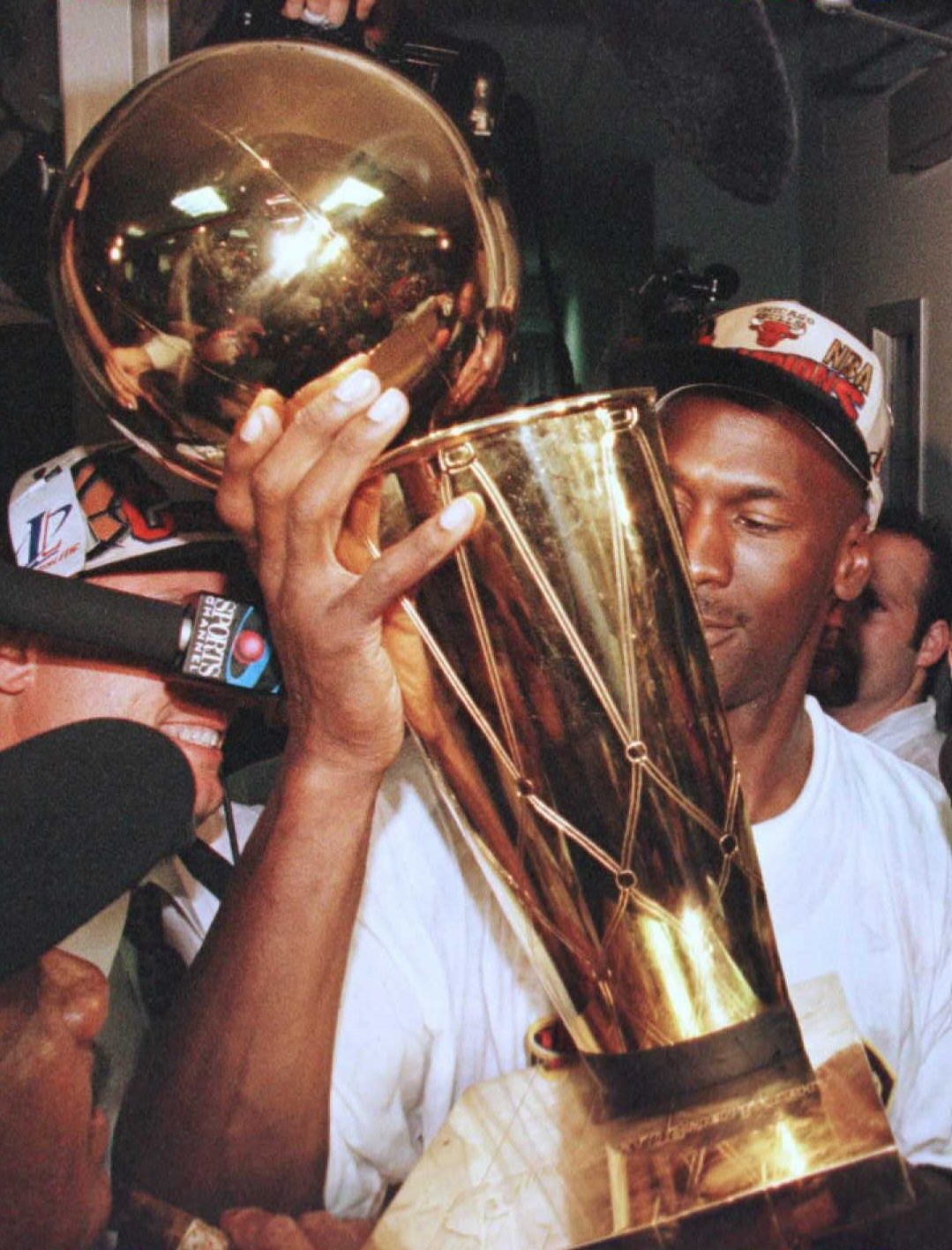 Michael Jordan holding the NBA Finals trophy