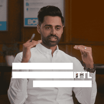 Hasan Minhaj gesturing with his hands and saying &quot;it&#x27;s a little overrated&quot;