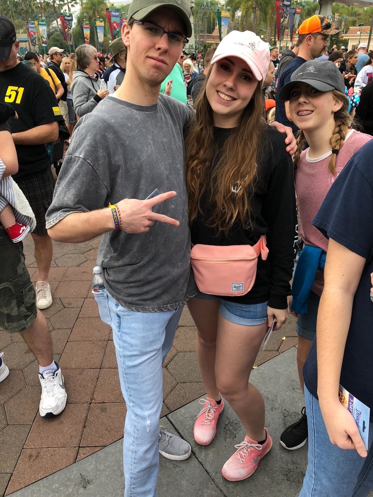 Reviewer wearing the fanny pack in pink at Disney