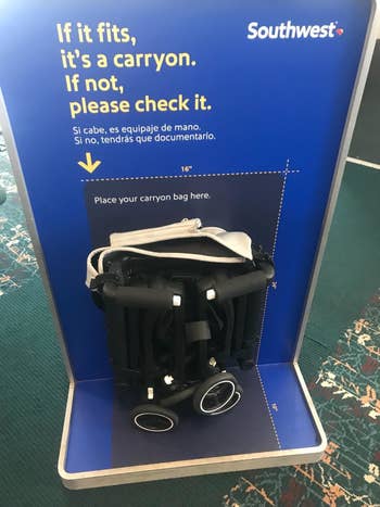 Reviewer's photo showing the folded stroller fitting the carryon size requirement for Southwest Airlines