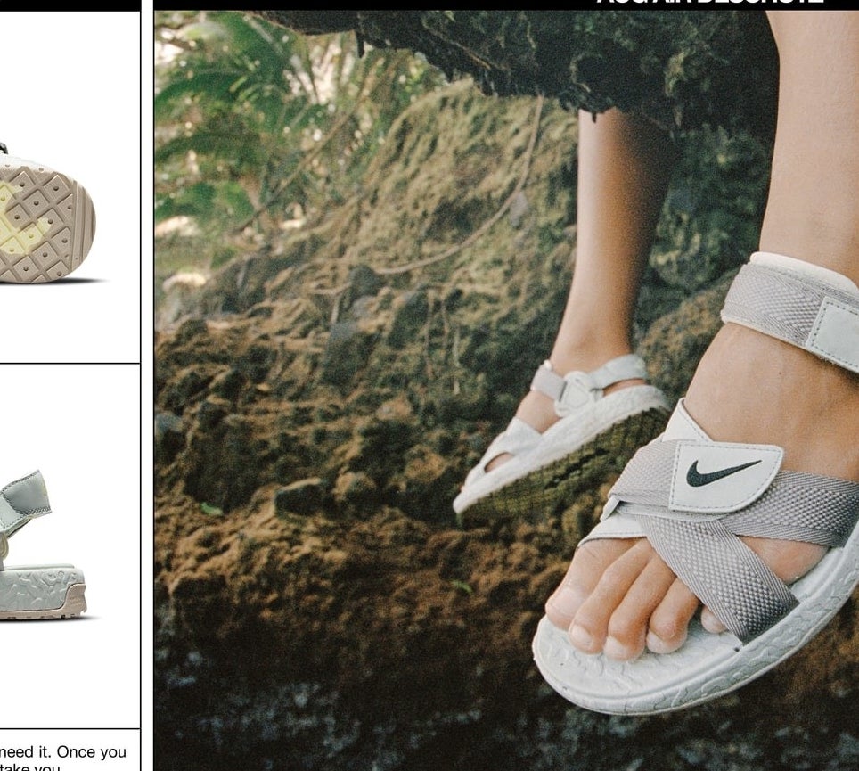 A person wearing the Nike sandals with their feet dangling off a rock