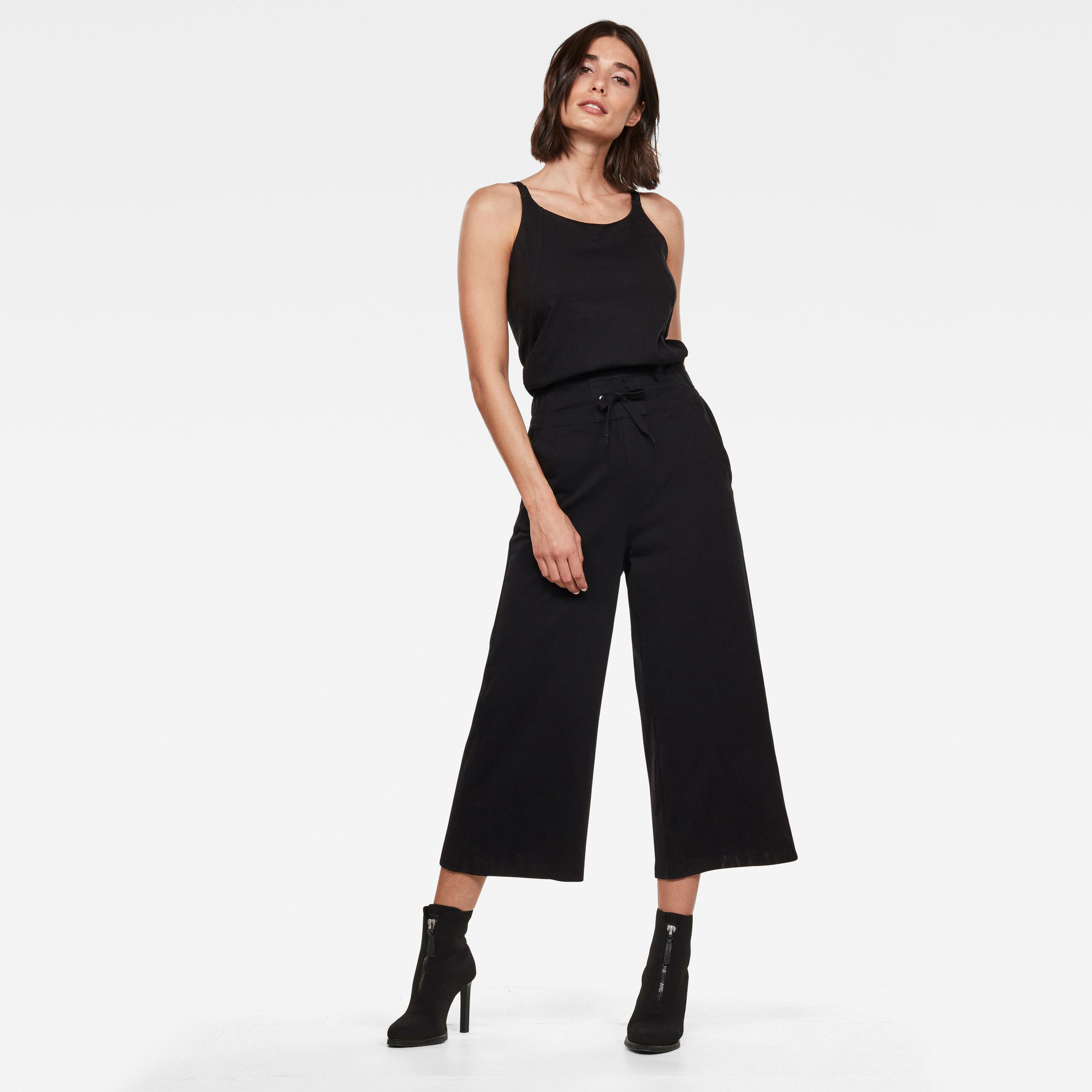 A model wears the black jumpsuit