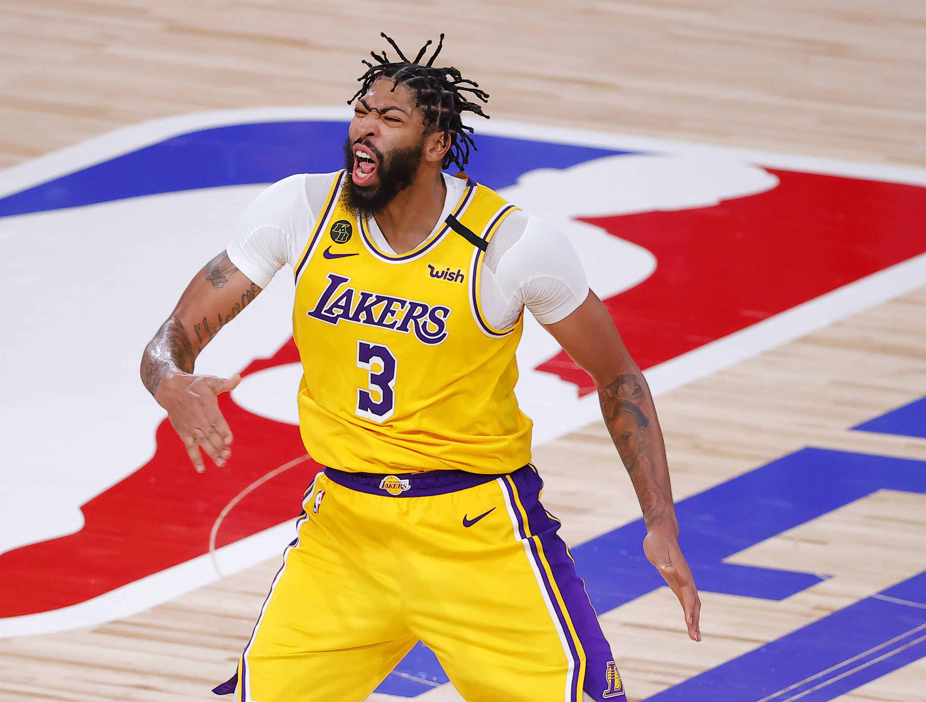 Yellow Laker jersey with purple lettering