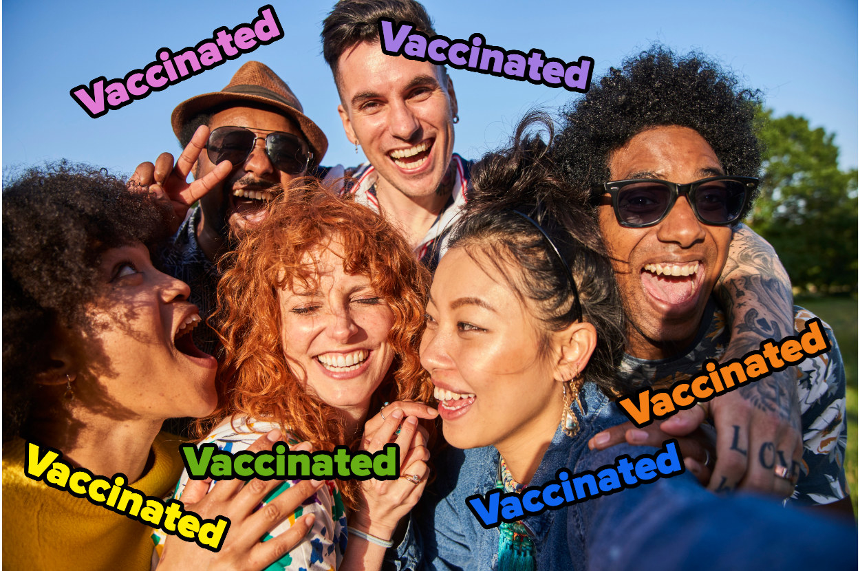 A group of people are all smiling. They have the word &quot;vaccinated&quot; over them.