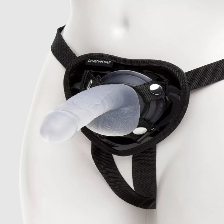 Black strap-on harness with clear dildo attached