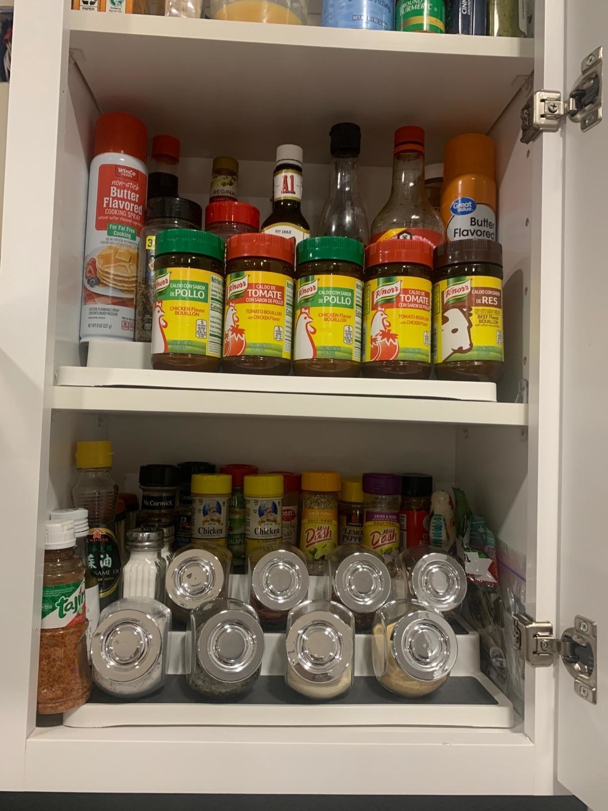 cabinet with gray nonskid shelves filled with different spice bottles
