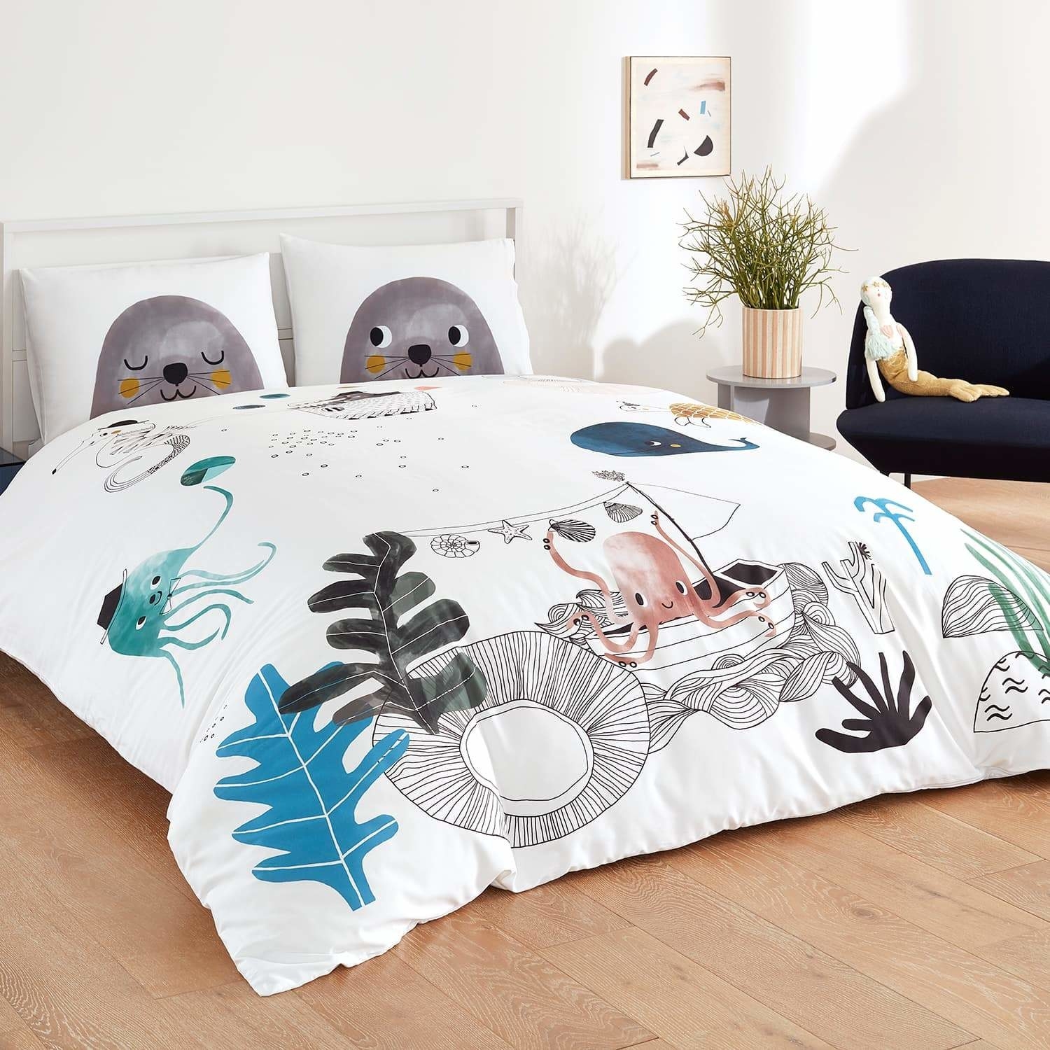 the underwater love bedding set on a bed