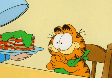 Someone serving Garfield a plate of lasagna
