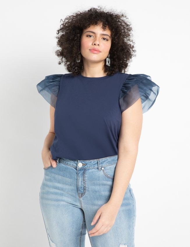 model wearing the top in navy