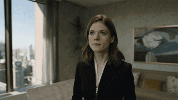 GIF of Maia Rindell from &quot;The Good Fight&quot; looking at a spacious apartment