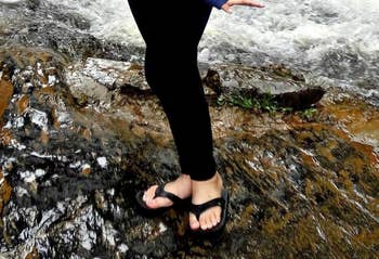 Reviewer wearing the black flip flops on a hike