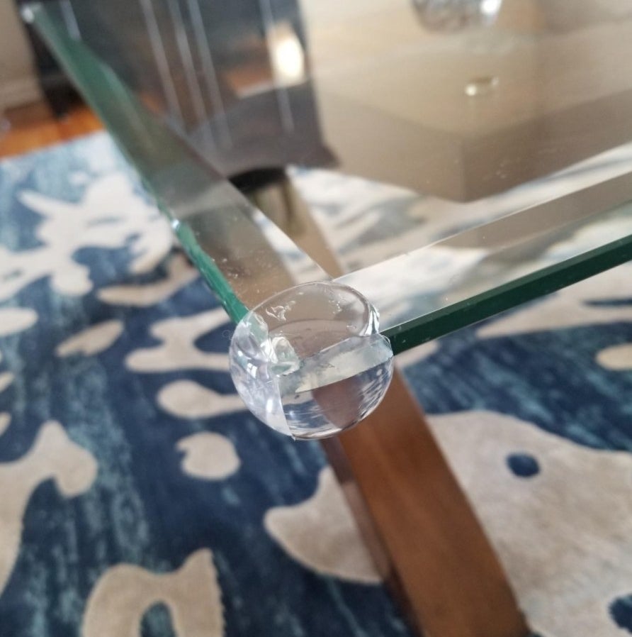 the babyproofing corner guards on a glass table