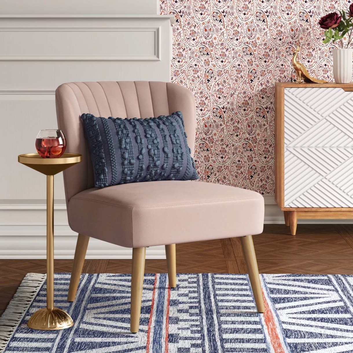 a blush colored upholstered accent chair