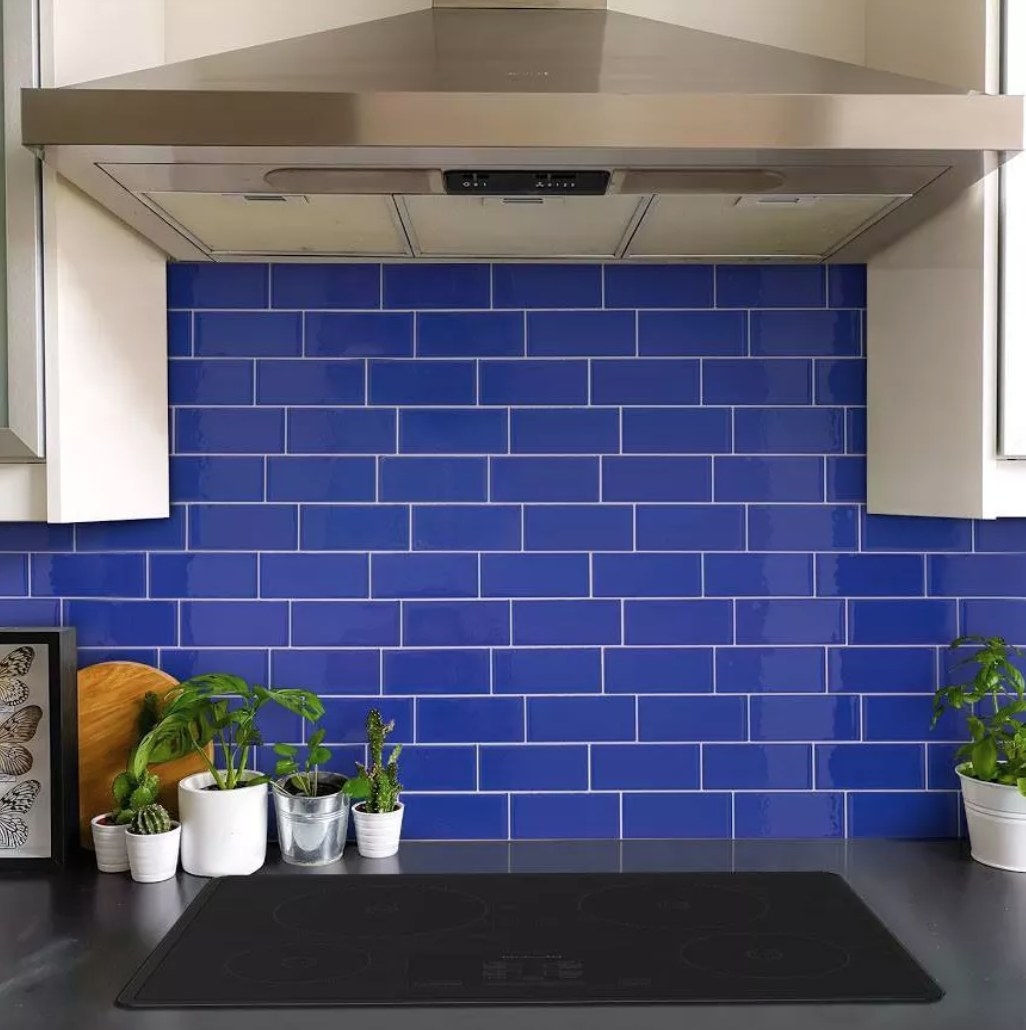 The tile in a kitchen in blue 