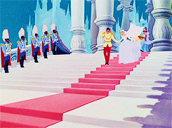 Cinderella and Prince Eric running down steps on their wedding day.