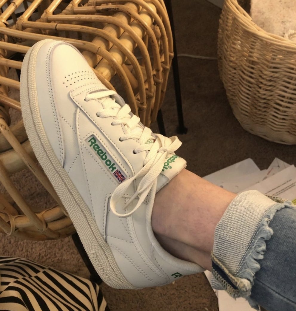 a customer wearing the shoe in white